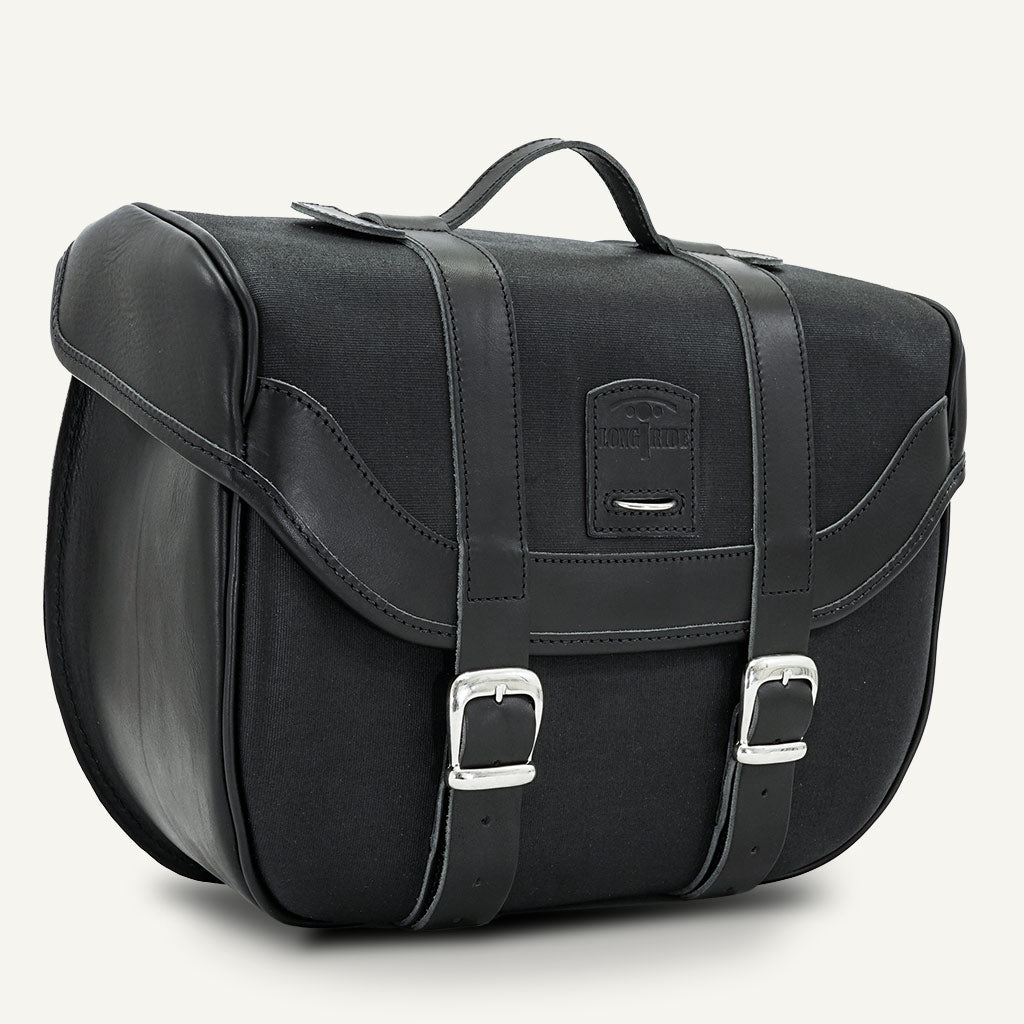 Belle valise moto noire avec poignée.